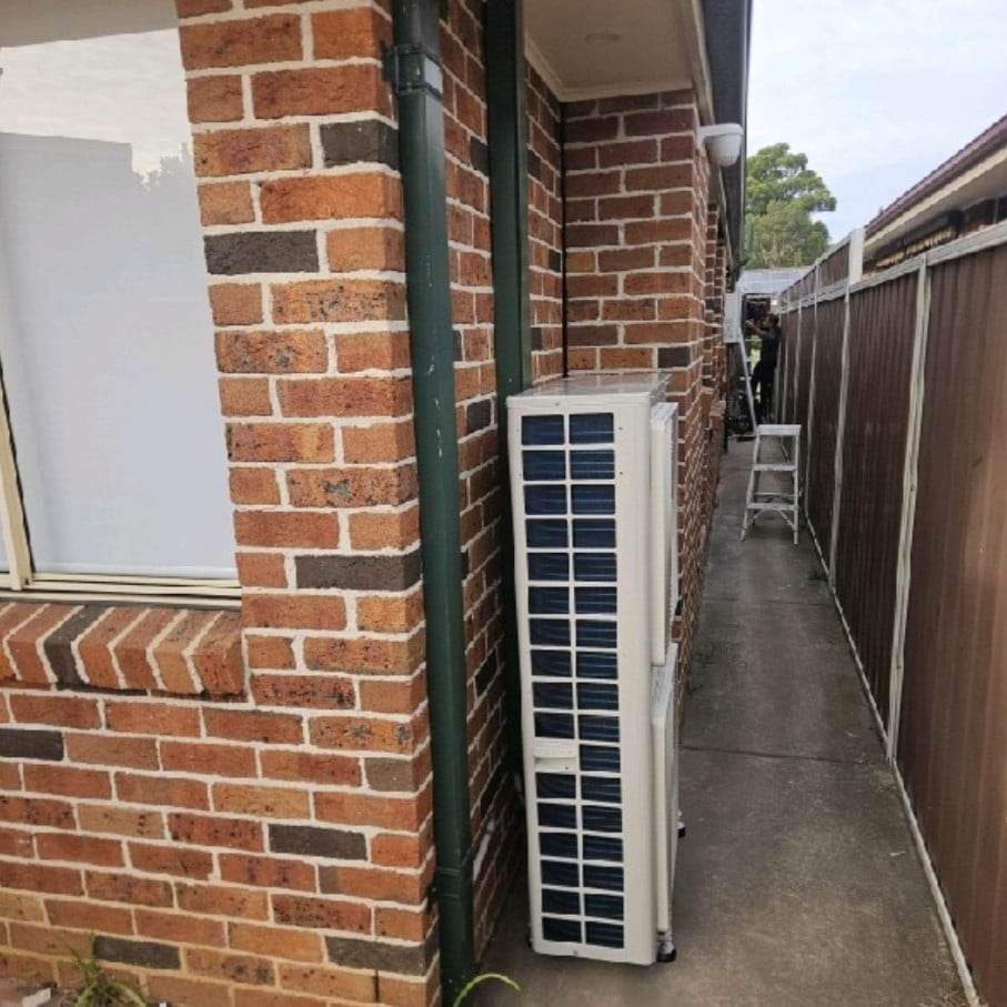Daikin ducted outdoor unit installed in the side passage of a St Andrews home