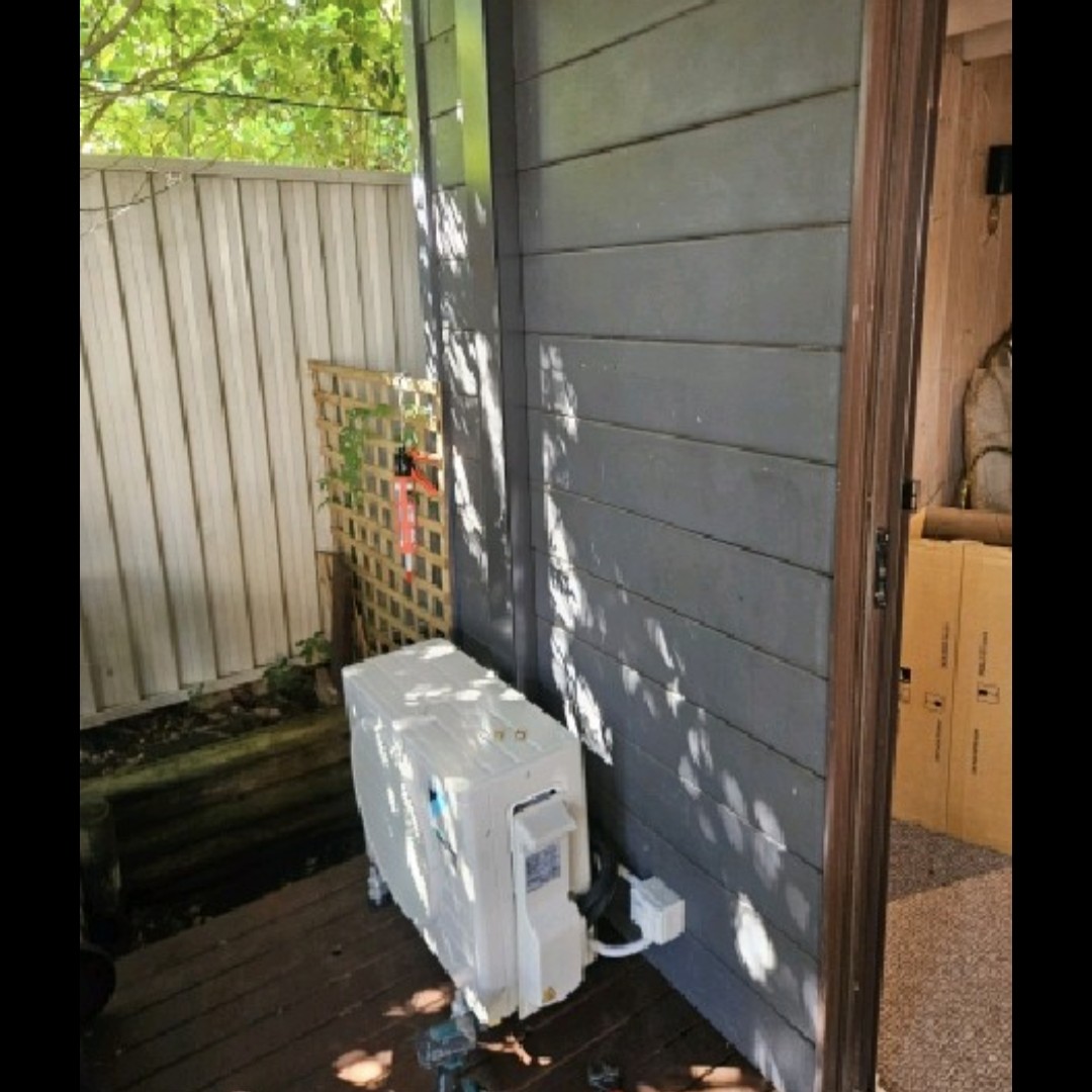 Daikin Cora split system outdoor unit installed on a deck at a Galston home.